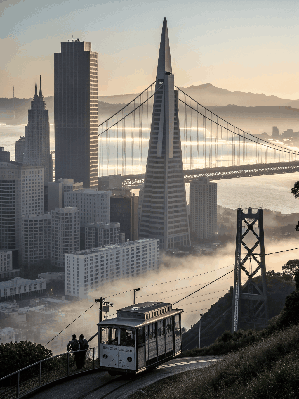 Fog rolling over San Francisco hills at dawn
